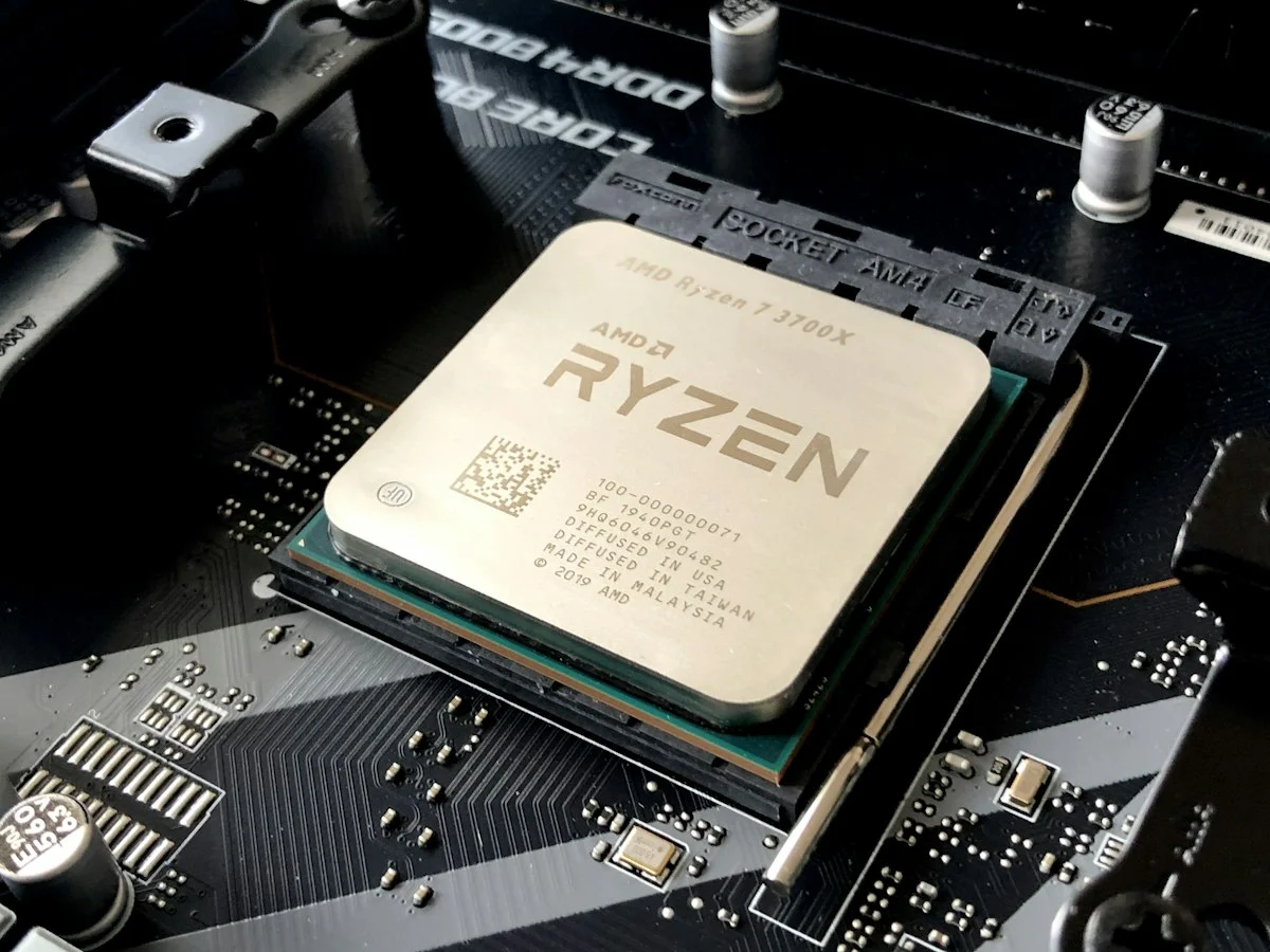 Microscopic die shot of AMD Ryzen AI processor highlighting the XDNA 2 neural processing engine
