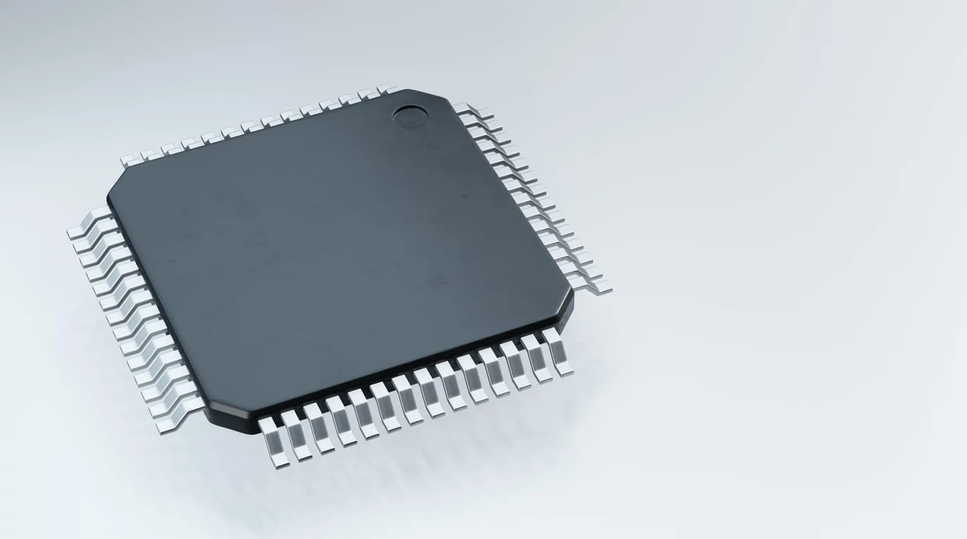 Close-up macro of a Qualcomm Snapdragon X Elite processor die showing the Hexagon NPU silicon area